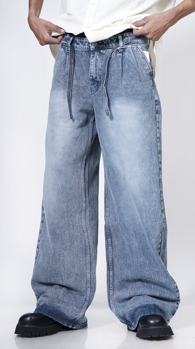 Wide-leg jeans worn by a person on a white background